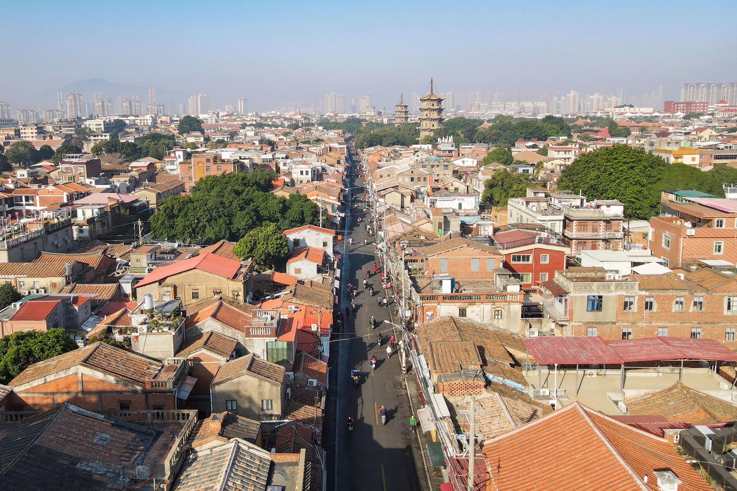 Pedestrians and historic buildings along West Street in Quanzhou